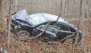 Deputy Eric Poynter is investigating this single vehicle accident on Ky. Rt. 377. - Photo by Dennis Brown