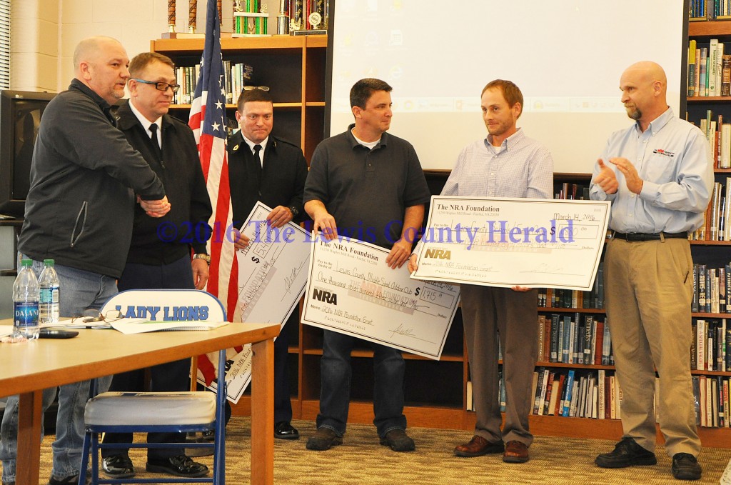 Lewis County Friends of NRA Chairman Kenny Ruckel, Chief Hilger, Sergeant Stone, LCMS teacher John Liles, Lewis County Family Resource Center Coordinator Mike Kennedy, and Kentucky NRA Field Representative John LaRowe. $1,880 grant awarded to Lewis County Public School District/Family Center. - Photo by Dennis Brown