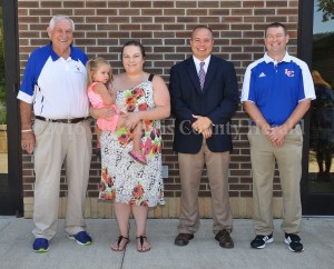 Pictured, left to right, are Gary Kidwell, Blakelyn Tackett, Emily Adams, LCHS Principal Jack Lykins and LCHS Football Coach Josh Hughes. Emily is the granddaughter of Paul Westerfield and Blakelyn is his great-granddaughter. - Photo by Dennis Brown