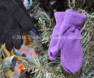 Kids' winter accessories adorn the Giving Tree at the Lewis County Courthouse. The donated items will be distributed to Lewis County school children. - Dennis Brown Photo