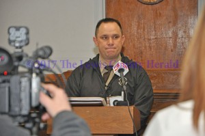 Sheriff Johnny Bivens fields questions from reporters during a press briefing on the murder of Justin Johnson. - Dennis Brown Photo