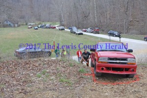 Sheriff Johnny Bivens marks the location of a pick-up truck that was recovered on Lower Twin Branch Road. - Dennis Brown Photo