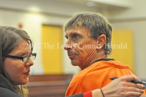Preston Neill Walters sits in Lewis District Court with his attorney, Krystle Rose. - Dennis Brown Photo