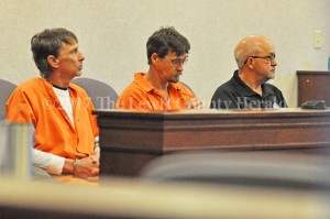 Preston Neill Walters and Wince Walters await their appearance before District Judge Brian McCloud. Jailer Jeff Lykins is seated at right. - Dennis Brown Photo