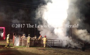 Firefighters battle a barn fire in Greenup County Wednesday night. The barn and its contents were destroyed. The cause remains under investigation - Hammer Cooper Photo