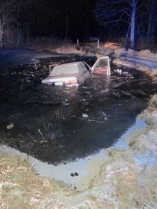 The vehicle involved in a pursuit came to a stop in a farm pond on Juniper Lane. Both vehicle occupants waded out of the pond. 