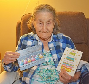 Dollslee Patton displays a couple birthday cards she received in recognition of her 100th birthday on Friday. - Dennis Brown Photo
