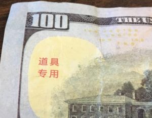 Chinese characters are seen on the obverse of the counterfeit $100.00 bills.
